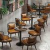 Bàn Cafe Chân Trụ Ghế Nệm Da Nâu 99%
